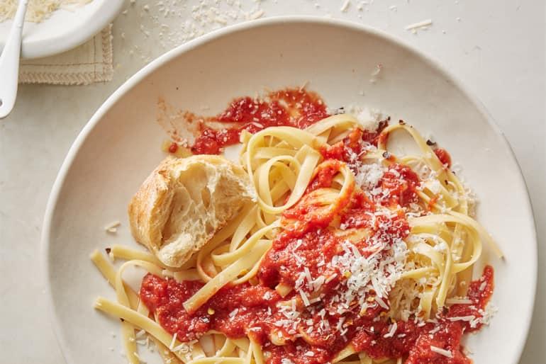 Overhead view of Tagliatelle pasta with toasted garlic marinara sauce made with Muir Glen Organic Plum Tomatoes.