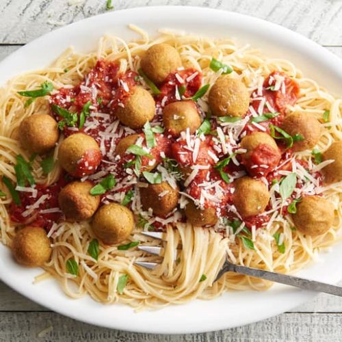 Pasta topped with vegetarian chickpea meatballs and pasta sauce