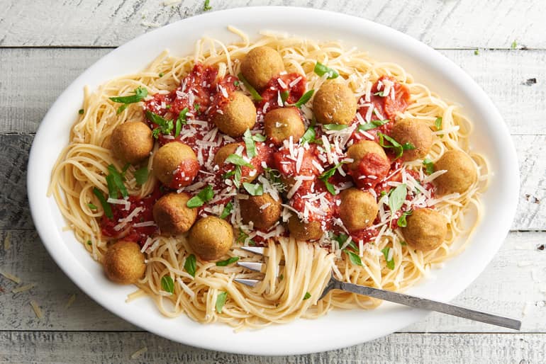 Pasta topped with vegetarian chickpea meatballs and pasta sauce