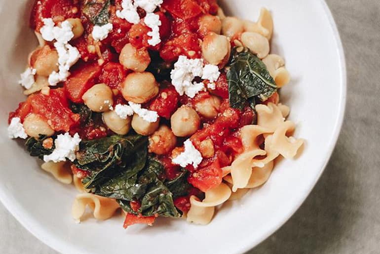 Muir Glen Diced Tomatoes No Salt Added sauce on pasta with chickpeas cheese and spinach.